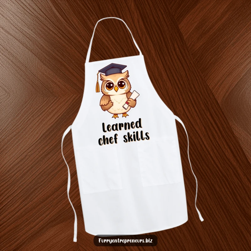 Funny owl in graduation attire holding a diploma, on a kitchen apron, perfect for chefs and academics, a fun funny gift.