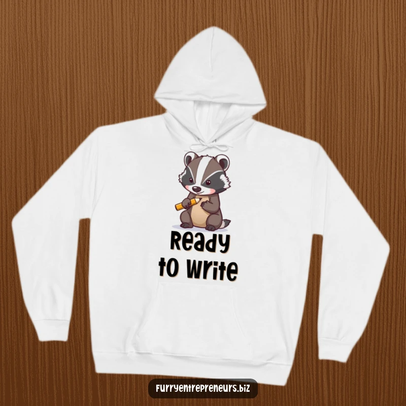 Funny hoodie with a determined badger character sharpening a tiny pencil, exuding warmth and focused determination.