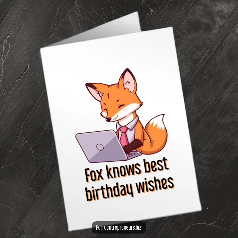 Funny free printable birthday card: A fox in a tie types intently on a laptop, conveying a hardworking yet humorous vibe.