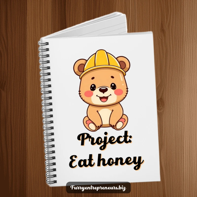 Funny bear cub in a construction helmet, smiling and ready to jot down plans, featured on a notebook cover.